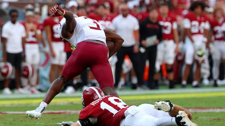 Sep 19, 2026; Tuscaloosa, Alabama, USA; Florida State Seminoles running back Samuel Singleton Jr. (3) is tripped up by Alabama Crimson Tide defensive back Bray Hubbard (18) during the first quarter at Saban Field at Bryant-Denny Stadium. Mandatory Credit: David Leong-Imagn Images
