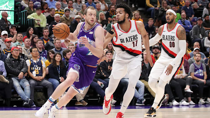 Dec 26, 2019; Salt Lake City, Utah, USA; Utah Jazz forward Joe Ingles (2) tries to dribble around Portland Trail Blazers forward Skal Labissiere (17) during the fourth quarter at Vivint Smart Home Arena. Utah Jazz won 121-115. Mandatory Credit: Chris Nicoll-Imagn Images