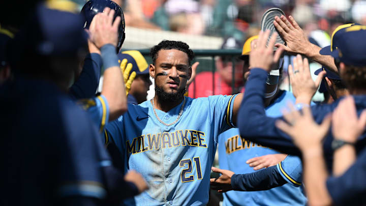 Apr 23, 2026; Detroit, Michigan, USA;  Milwaukee Brewers right fielder Luis Matos (21) celebrates in the dugout after scoring on a two-run double by teammate Blake Perkins (not pictured) against the Detroit Tigers in the seventh inning at Comerica Park. Mandatory Credit: Lon Horwedel-Imagn Images