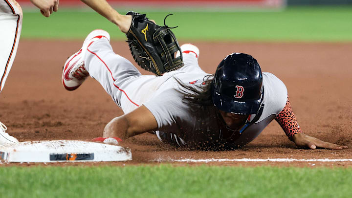 Aug 25, 2025; Baltimore, Maryland, USA; Boston Red Sox outfielder Jhostynxon Garcia (51) slides safely into first base during the ninth inning against the Baltimore Orioles at Oriole Park at Camden Yards. Mandatory Credit: Daniel Kucin Jr.-Imagn Images Aug 25, 2025; Baltimore, Maryland, USA; Boston Red Sox outfielder Jhostynxon Garcia (51) slides safely into first base during the ninth inning against the Baltimore Orioles at Oriole Park at Camden Yards. Mandatory Credit: Daniel Kucin Jr.-Imagn Images