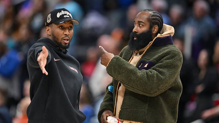 Feb 27, 2026; Detroit, Michigan, USA;   Cleveland Cavaliers guard Donovan Mitchell (left) talks with teammate James Harden during a timeout against the Detroit Pistons in the second half at Little Caesars Arena. Neither played in their overtime loss to the Pistons. Mandatory Credit: Lon Horwedel-Imagn Images