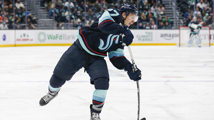 Dec 29, 2021; Seattle, Washington, USA; Seattle Kraken center Yanni Gourde (37) shoots against the Philadelphia Flyers during the third period at Climate Pledge Arena. Mandatory Credit: Joe Nicholson-Imagn Images
