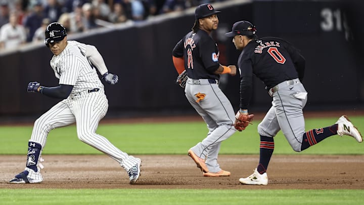 Aug 21, 2024; Bronx, New York, USA;  Cleveland Guardians second baseman Andrés Giménez (0) chases New York Yankees right fielder Juan Soto (22) during a run-down in the fourth inning at Yankee Stadium. Mandatory Credit: Wendell Cruz-Imagn Images