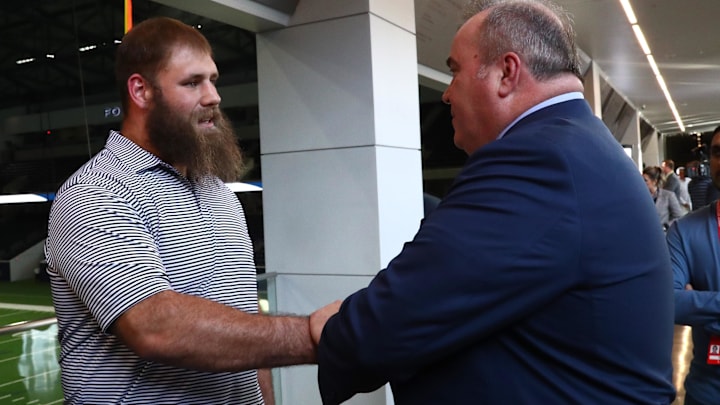 Dallas Cowboys head coach Mike McCarthy meets with center Travis Frederick after a press conference at Ford Center. Dallas Cowboys head coach Mike McCarthy meets with center Travis Frederick after a press conference at Ford Center.