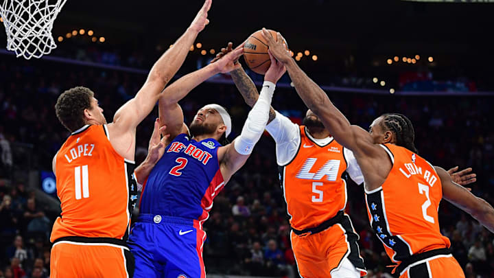Dec 28, 2025; Inglewood, California, USA; Detroit Pistons guard Cade Cunningham (2) moves to the basket against Los Angeles Clippers center Brook Lopez (11) forward Derrick Jones Jr. (5) and forward Kawhi Leonard (2) during the second half at Intuit Dome. Mandatory Credit: Gary A. Vasquez-Imagn Images