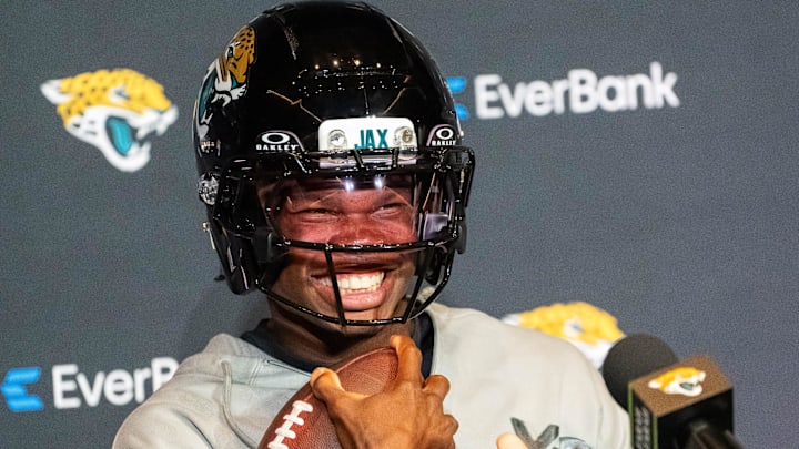 The Jacksonville Jaguars’ first-round pick, Colorado Buffaloes wide receiver and defensive back Travis Hunter sits in his chair with his helmet on and acting as if he was running after answering questions during a press conference Friday, March 25, 2025 at Miller Electric Center in Jacksonville, Fla. [Doug Engle/Florida Times-Union]