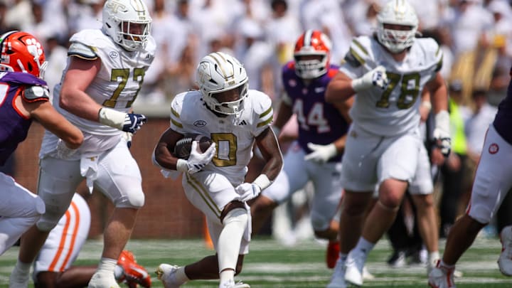 Sep 13, 2025; Atlanta, Georgia, USA; Georgia Tech Yellow Jackets running back Malachi Hosley (0) runs the ball against the Clemson Tigers in the second quarter at Bobby Dodd Stadium at Hyundai Field. Mandatory Credit: Brett Davis-Imagn Images