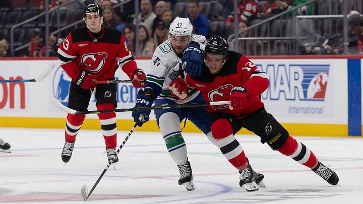 Vancouver Canucks left wing Paul Cotter (47) and New Jersey Devils center Cody Glass (12) go after the puck during the first period at Prudential Center. Mandatory Credit: Thomas Salus-Imagn Images Vancouver Canucks left wing Paul Cotter (47) and New Jersey Devils center Cody Glass (12) go after the puck during the first period at Prudential Center. Mandatory Credit: Thomas Salus-Imagn Images