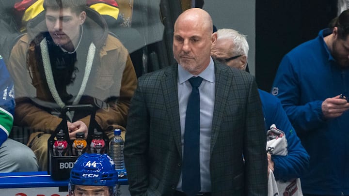 Vancouver Canucks head coach Rick Tocchet on the bench against the Colorado Avalanche.