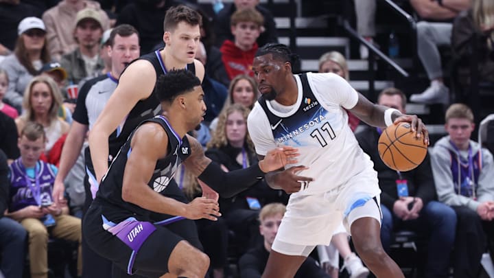 Minnesota Timberwolves center Naz Reid drives against Utah Jazz forward KJ Martin, front left, and center Walker Kessler during the second quarter at Delta Center in Salt Lake City on Feb. 28, 2025.