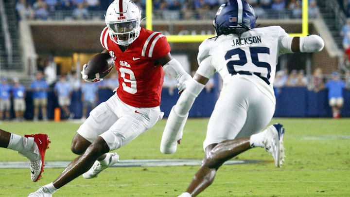 Sep 21, 2024; Oxford, Mississippi, USA; Mississippi Rebels wide receiver Tre Harris (9) runs after a catch as Georgia Southern Eagles defensive back Ayden Jackson (25) pursues during the first half at Vaught-Hemingway Stadium. Mandatory Credit: Petre Thomas-Imagn Images