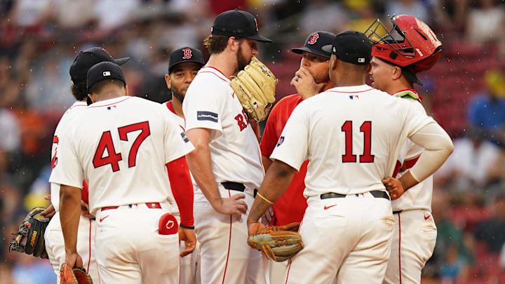 Jun 30, 2024; Boston, Massachusetts, USA; Boston Red Sox pitching coach Andrew Bailey (53) talks with relief pitcher Justin Slaten (63) in the seventh inning against the San Diego Padres at Fenway Park. Mandatory Credit: David Butler II-Imagn Images