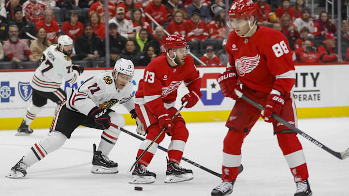 Jan 10, 2025; Detroit, Michigan, USA; Detroit Red Wings right wing Alex DeBrincat (93) handles the puck during the first period against the Chicago Blackhawks at Little Caesars Arena. Mandatory Credit: Brian Bradshaw Sevald-Imagn Images