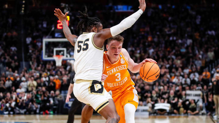 Tennessee guard Dalton Knecht (3) dribbles against Purdue guard Lance Jones (55) during the second half of the NCAA tournament Midwest Regional Elite 8 round at Little Caesars Arena in Detroit on Sunday, March 31, 2024. Tennessee guard Dalton Knecht (3) dribbles against Purdue guard Lance Jones (55) during the second half of the NCAA tournament Midwest Regional Elite 8 round at Little Caesars Arena in Detroit on Sunday, March 31, 2024.