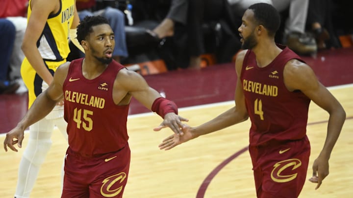Apr 12, 2024; Cleveland, Ohio, USA; Cleveland Cavaliers guard Donovan Mitchell (45) and forward Evan Mobley (4) celebrate in the fourth quarter against the Indiana Pacers at Rocket Mortgage FieldHouse. Mandatory Credit: David Richard-Imagn Images