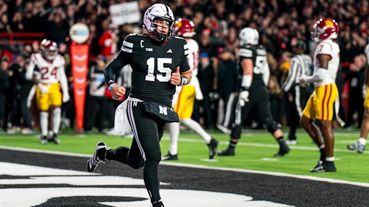 Nov 1, 2025; Lincoln, Nebraska, USA; Nebraska Cornhuskers quarterback Dylan Raiola (15) runs off after scoring a touchdown against the Southern California Trojans during the first quarter at Memorial Stadium. Mandatory Credit: Dylan Widger-Imagn Images
