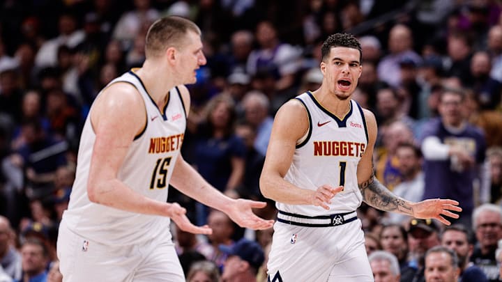 Mar 21, 2024; Denver, Colorado, USA; Denver Nuggets forward Michael Porter Jr. (1) and center Nikola Jokic (15) in the third quarter against the New York Knicks at Ball Arena. Mandatory Credit: Isaiah J. Downing-Imagn Images