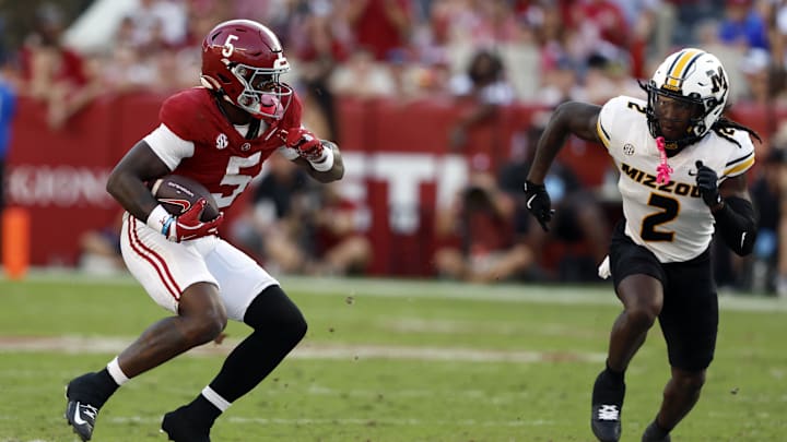 Oct 26, 2024; Tuscaloosa, Alabama, USA; Alabama Crimson Tide wide receiver Germie Bernard (5) carries the ball after a reception against Missouri Tigers cornerback Toriano Pride Jr. (2) during the second half at Bryant-Denny Stadium. Mandatory Credit: Butch Dill-Imagn Images Oct 26, 2024; Tuscaloosa, Alabama, USA; Alabama Crimson Tide wide receiver Germie Bernard (5) carries the ball after a reception against Missouri Tigers cornerback Toriano Pride Jr. (2) during the second half at Bryant-Denny Stadium. Mandatory Credit: Butch Dill-Imagn Images