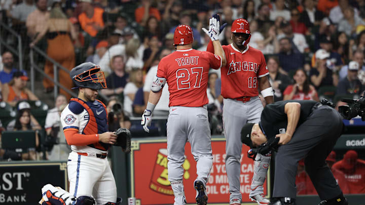 Apr 11, 2025; Houston, Texas, USA; Los Angeles Angels designated hitter Jorge Soler (12) celebrates right fielder Mike Trout (27) home run against the Houston Astros  in the second inning at Daikin Park. Mandatory Credit: Thomas Shea-Imagn Images