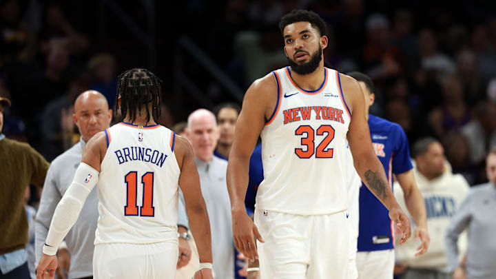 Jan 9, 2026; Phoenix, Arizona, USA; New York Knicks center Karl-Anthony Towns (32) and guard Jalen Brunson (11) against the Phoenix Suns at Mortgage Matchup Center. Mandatory Credit: Mark J. Rebilas-Imagn Images