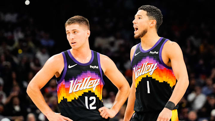 Nov 13, 2025; Phoenix, Arizona, USA; Phoenix Suns guard Collin Gillespie (12) and Phoenix Suns guard Devin Booker (1) during the first half of the game at Mortgage Matchup Center. Mandatory Credit: Arianna Grainey-Imagn Images Nov 13, 2025; Phoenix, Arizona, USA; Phoenix Suns guard Collin Gillespie (12) and Phoenix Suns guard Devin Booker (1) during the first half of the game at Mortgage Matchup Center. Mandatory Credit: Arianna Grainey-Imagn Images