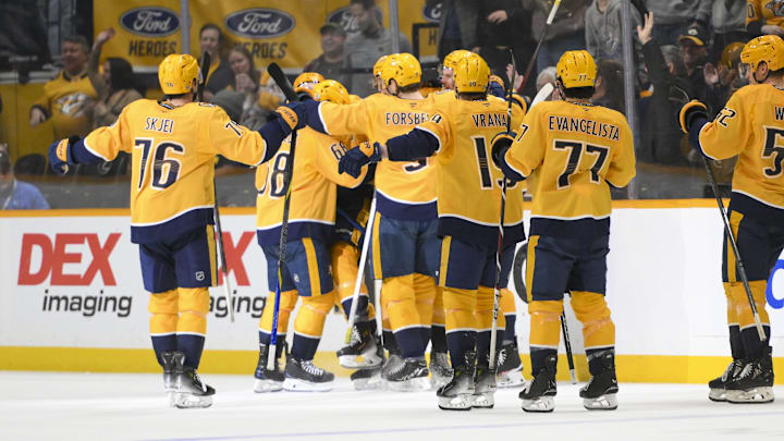 Apr 8, 2025; Nashville, Tennessee, USA;  Nashville Predators center Fedor Svechkiv (40) celebrates his game=winning goal with his teammates  during the over time period at Bridgestone Arena. Mandatory Credit: Steve Roberts-Imagn Images