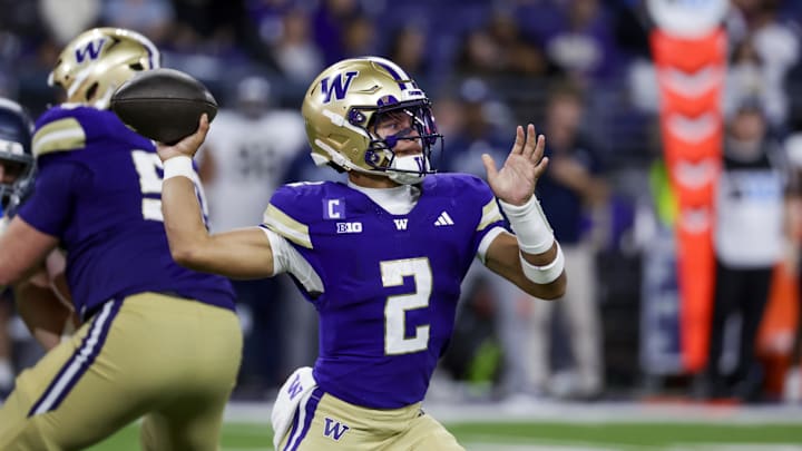 Sep 6, 2025; Seattle, Washington, USA; Washington Huskies quarterback Demond Williams Jr. (2) poses against the UC Davis Aggies during the third quarter at Husky Stadium. Mandatory Credit: Joe Nicholson-Imagn Images