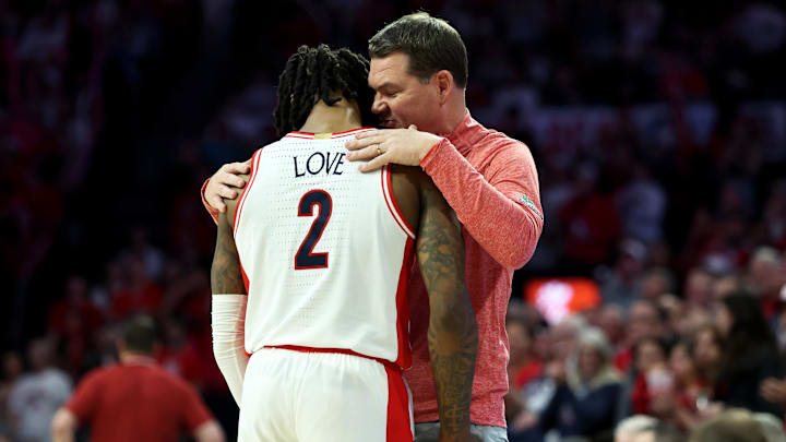 Arizona Wildcats guard Caleb Love (2) and head coach Tommy Lloyd have formed a special bond.