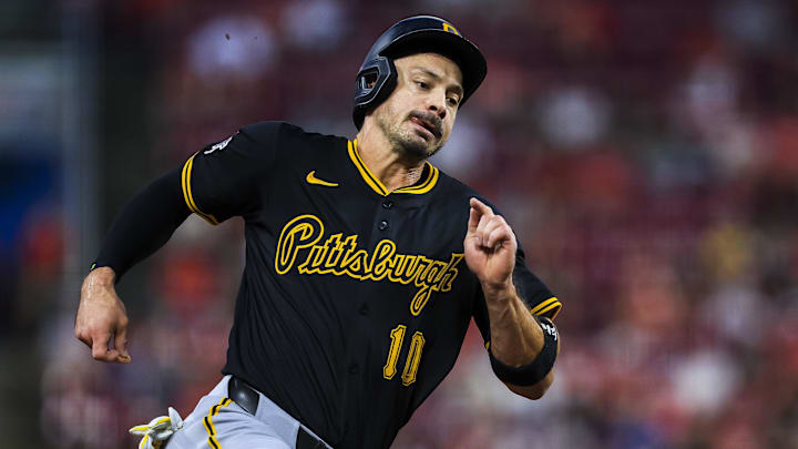 Sep 24, 2025; Cincinnati, Ohio, USA; Pittsburgh Pirates outfielder Bryan Reynolds (10) scores on a double hit by first baseman Spencer Horwitz (not pictured) in the fourth inning against the Cincinnati Reds at Great American Ball Park. M Sep 24, 2025; Cincinnati, Ohio, USA; Pittsburgh Pirates outfielder Bryan Reynolds (10) scores on a double hit by first baseman Spencer Horwitz (not pictured) in the fourth inning against the Cincinnati Reds at Great American Ball Park. M