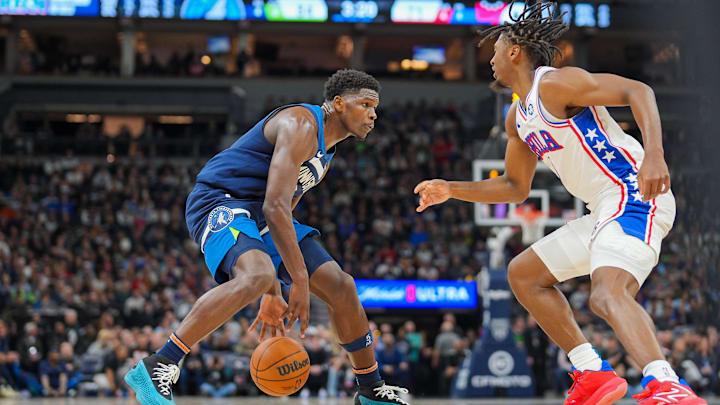Nov 22, 2023; Minneapolis, Minnesota, USA; Minnesota Timberwolves guard Anthony Edwards (5) dribbles against the Philadelphia 76ers guard Tyrese Maxey (0) in the third quarter at Target Center. Mandatory Credit: Brad Rempel-Imagn Images