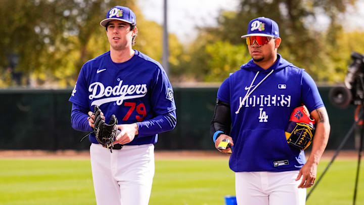 Feb 18, 2026; Glendale, AZ, USA;  Los Angeles Dodger  Pitcher Nick Frasso (79) walks with pitcher Brusdar Graterol (48) during Los Angeles Dodger workouts at Camelback Ranch in Glendale, Arizona. Mandatory Credit: Arianna Grainey-Imagn Images