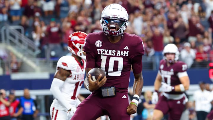 Texas A&M Aggies quarterback Marcel Reed (10) reacts after scoring a touchdown during the first half against the Arkansas Razorbacks at AT&T Stadium.