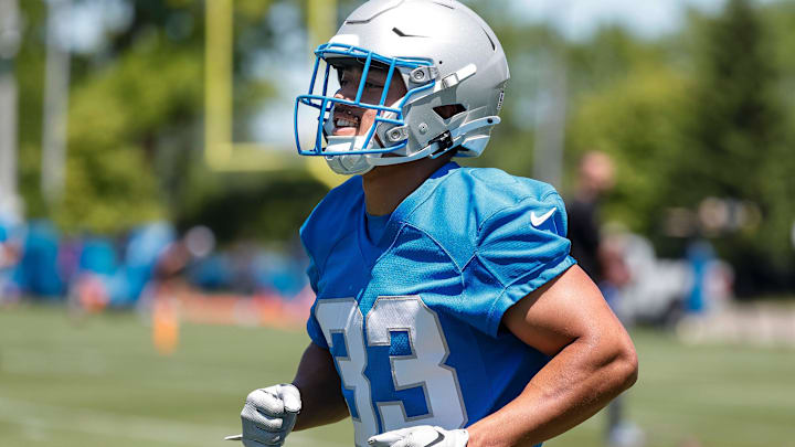 Former Utah Utes football running back Sione Vaki (33) practices during OTAs at Detroit Lions headquarters