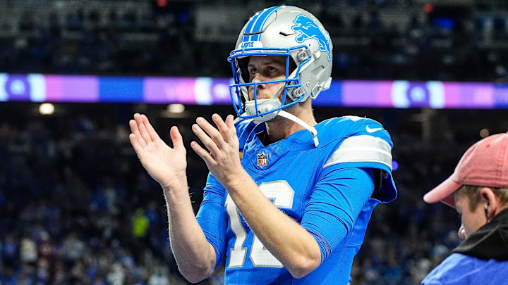 Detroit Lions quarterback Jared Goff (16) applauds for teammates art warm up before the NFC divisional round between Detroit Lions and Washington Commanders at Ford Field in Detroit on Saturday, Jan. 18, 2025.