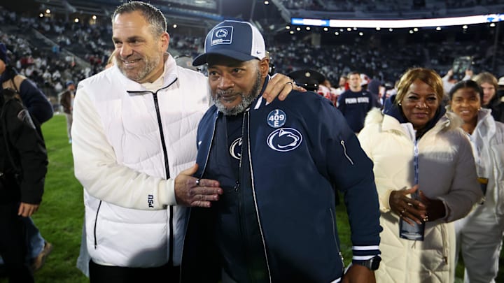 Penn State Nittany Lions interim head coach Terry Smith is congratulated by athletic director Pat Kraft following the game against the Nebraska Cornhuskers at Beaver Stadium. 