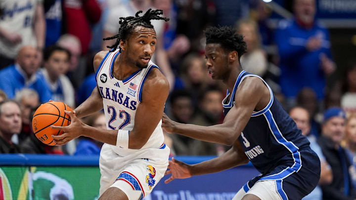 Jan 31, 2026; Lawrence, Kansas, USA; Kansas Jayhawks guard Darryn Peterson (22) looks to pass against BYU Cougars forward AJ Dybantsa (3) during the first half at Mizzou Arena. Mandatory Credit: Jay Biggerstaff-Imagn Images