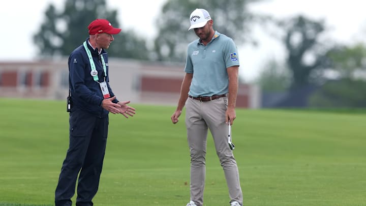 Sam Burns talks to a rules official during the final round of the 2025 U.S. Open at Oakmont Country Club