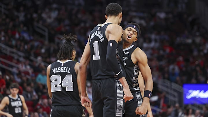 Dec 11, 2023; Houston, Texas, USA; San Antonio Spurs center Victor Wembanyama (1) celebrates with forward Keldon Johnson (3) after scoring a basket during the third quarter against the Houston Rockets at Toyota Center.