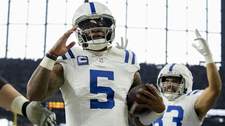Dec 22, 2024; Indianapolis, Indiana, USA; Indianapolis Colts quarterback Anthony Richardson (5) celebrates after rushing for a touchdown during a game against the Tennessee Titans at Lucas Oil Stadium. Mandatory Credit: Christine Tannous/USA Today Network via Imagn Images 