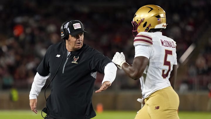 Sep 13, 2025; Stanford, California, USA; Boston College Eagles running back Jordan McDonald (5) is congratulated by head coach Bill O'Brien (left) after scoring a touchdown against the Stanford Cardinal during the second quarter at Stanford Stadium. Mandatory Credit: Darren Yamashita-Imagn Images