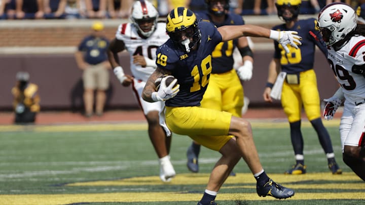 Sep 14, 2024; Ann Arbor, Michigan, USA; Michigan Wolverines tight end Colston Loveland (18) runs the ball first half against the Arkansas State Red Wolves at Michigan Stadium. Sep 14, 2024; Ann Arbor, Michigan, USA; Michigan Wolverines tight end Colston Loveland (18) runs the ball first half against the Arkansas State Red Wolves at Michigan Stadium.