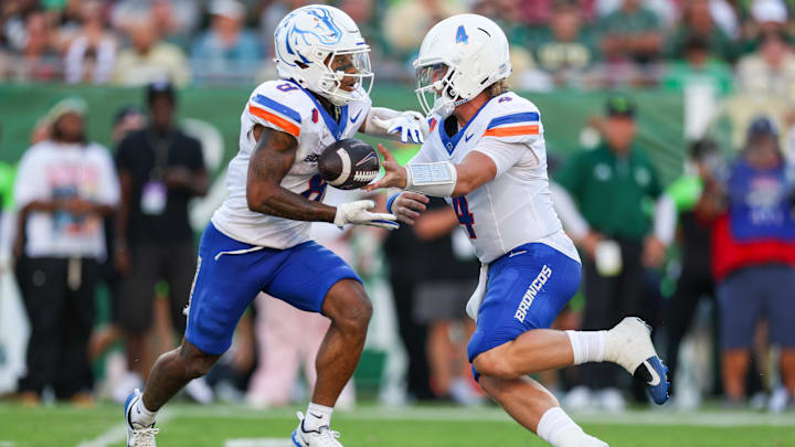 Boise State quarterback Maddux Madsen hands off to Malik Sherrod.