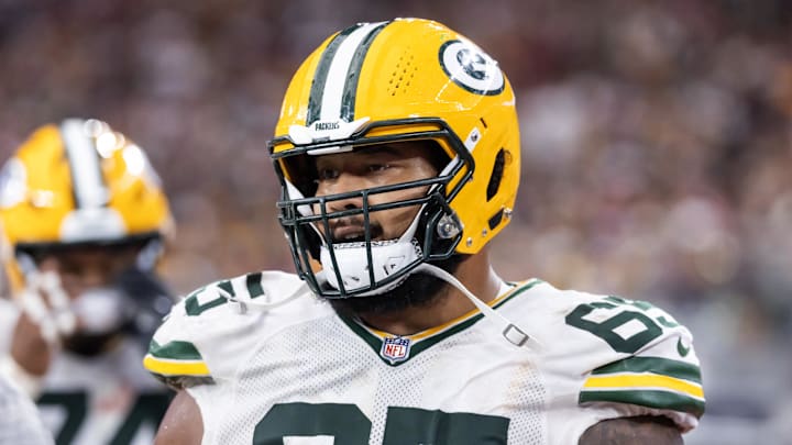 Oct 19, 2025; Glendale, Arizona, USA; Green Bay Packers guard Aaron Banks (65) against the Arizona Cardinals at State Farm Stadium. Mandatory Credit: Mark J. Rebilas-Imagn Images