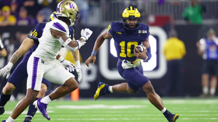 Jan 8, 2024; Houston, TX, USA; Michigan Wolverines quarterback Alex Orji (10) runs with the ball against the Washington Huskies during the second quarter in the 2024 College Football Playoff national championship game at NRG Stadium. Mandatory Credit: Mark J. Rebilas-USA TODAY Sports