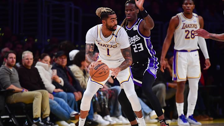 Dec 28, 2024; Los Angeles, California, USA; Los Angeles Lakers guard D'Angelo Russell (1) controls the ball against Sacramento Kings guard Keon Ellis (23) during the first half at Crypto.com Arena. Mandatory Credit: Gary A. Vasquez-Imagn Images Dec 28, 2024; Los Angeles, California, USA; Los Angeles Lakers guard D'Angelo Russell (1) controls the ball against Sacramento Kings guard Keon Ellis (23) during the first half at Crypto.com Arena. Mandatory Credit: Gary A. Vasquez-Imagn Images