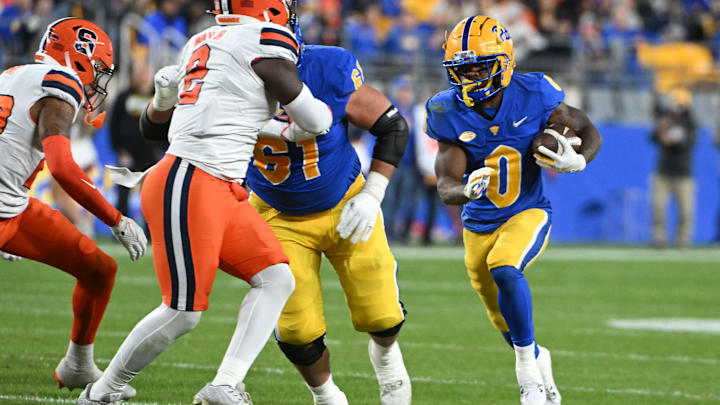 Oct 24, 2024; Pittsburgh, Pennsylvania, USA; Pittsburgh Panthers running back Desmond Reid (0) runs against the Syracuse Orange during the third quarter at Acrisure Stadium. Mandatory Credit: Barry Reeger-Imagn Images