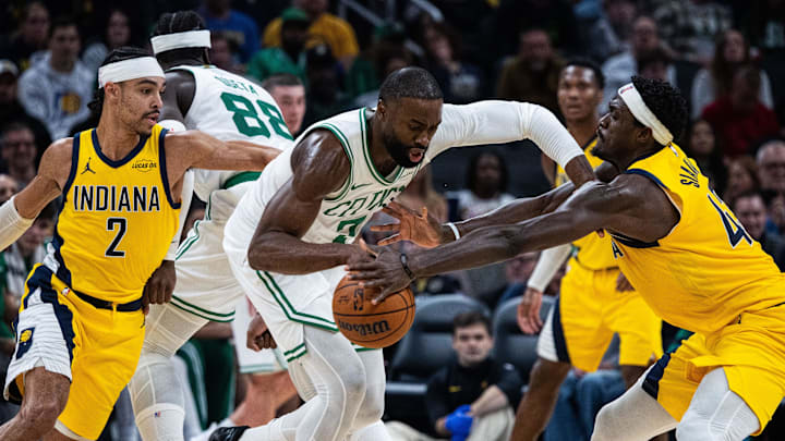 Dec 26, 2025; Indianapolis, Indiana, USA; Boston Celtics guard/forward Jaylen Brown (7) dribbles the ball while Indiana Pacers forward Pascal Siakam (43) defends in the first half at Gainbridge Fieldhouse. Mandatory Credit: Trevor Ruszkowski-Imagn Images