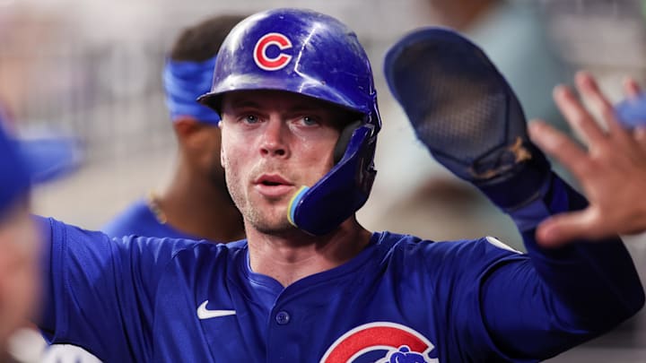 Sep 8, 2025; Atlanta, Georgia, USA; Chicago Cubs second baseman Nico Hoerner (2) celebrates with teammates after scoring a run against the Atlanta Braves in the seventh inning at Truist Park. 