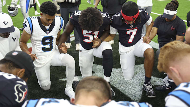 Carolina Panthers quarterback Bryce Young (9) and Houston Texans defensive end Will Anderson Jr. 