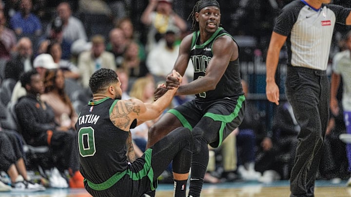 Nov 1, 2024; Charlotte, North Carolina, USA; Boston Celtics guard Jrue Holiday (4) helps forward Jayson Tatum (0) onto his feet after a foul late during the second half against the Charlotte Hornets at the Spectrum Center. Mandatory Credit: Jim Dedmon-Imagn Images Nov 1, 2024; Charlotte, North Carolina, USA; Boston Celtics guard Jrue Holiday (4) helps forward Jayson Tatum (0) onto his feet after a foul late during the second half against the Charlotte Hornets at the Spectrum Center. Mandatory Credit: Jim Dedmon-Imagn Images